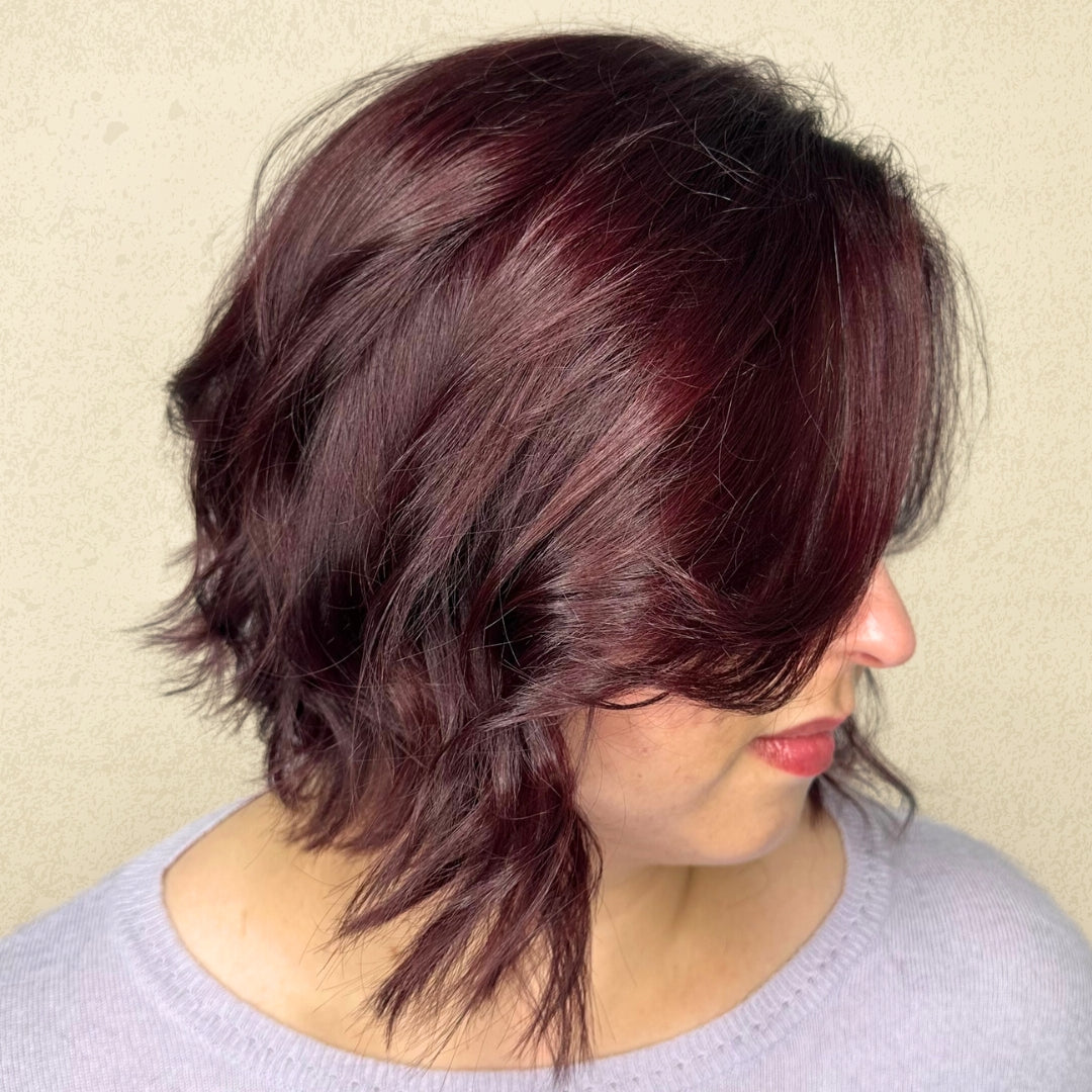 This is an image of one of Ippodaro Natural Salon’s customers moments after a stylist finished their color services. This image showcases a beautiful auburn-brunette and her new color.