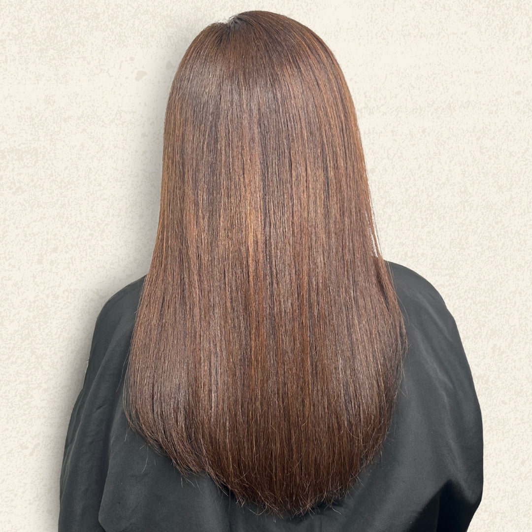 This is an image of one of Ippodaro Natural Salon’s customers moments after a stylist finished their color services. This image showcases a beautiful brunette and her new balayage. We see the back of her hair, to really admire her new look. 