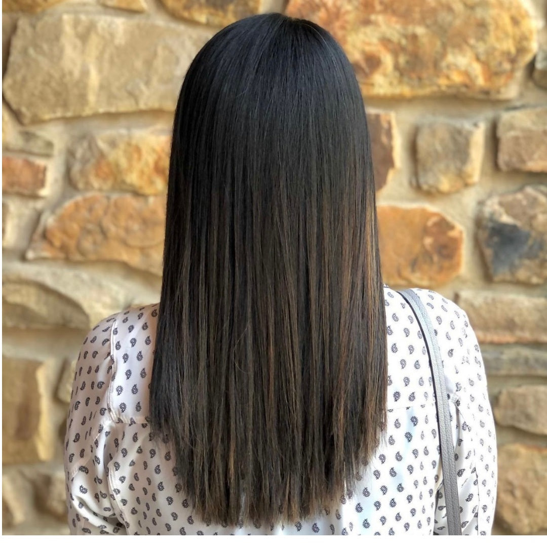 This is an image of Ippodaro Natural Salon's (the San Antonio salon that prioritizes your health) customer moments after finishing a hair smoothing treatment.