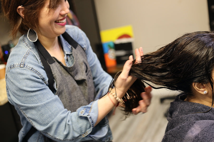 This is an image of Terri working on a clients hair, using both sustainable and natural hair care, and providing a tip top experience for the guest! This image is used on the "About Us" page on the Ippodaro Natural Salon website. (Ippodaro Natural Salon is located in San Antonio Texas)