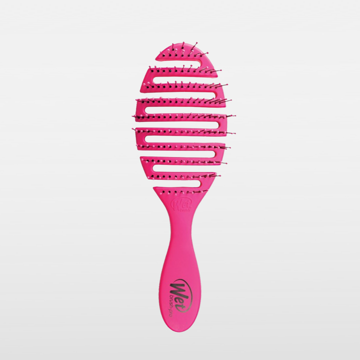 Wet Brush. White background, pink brush, black lettering. At Ippodaro Salon.